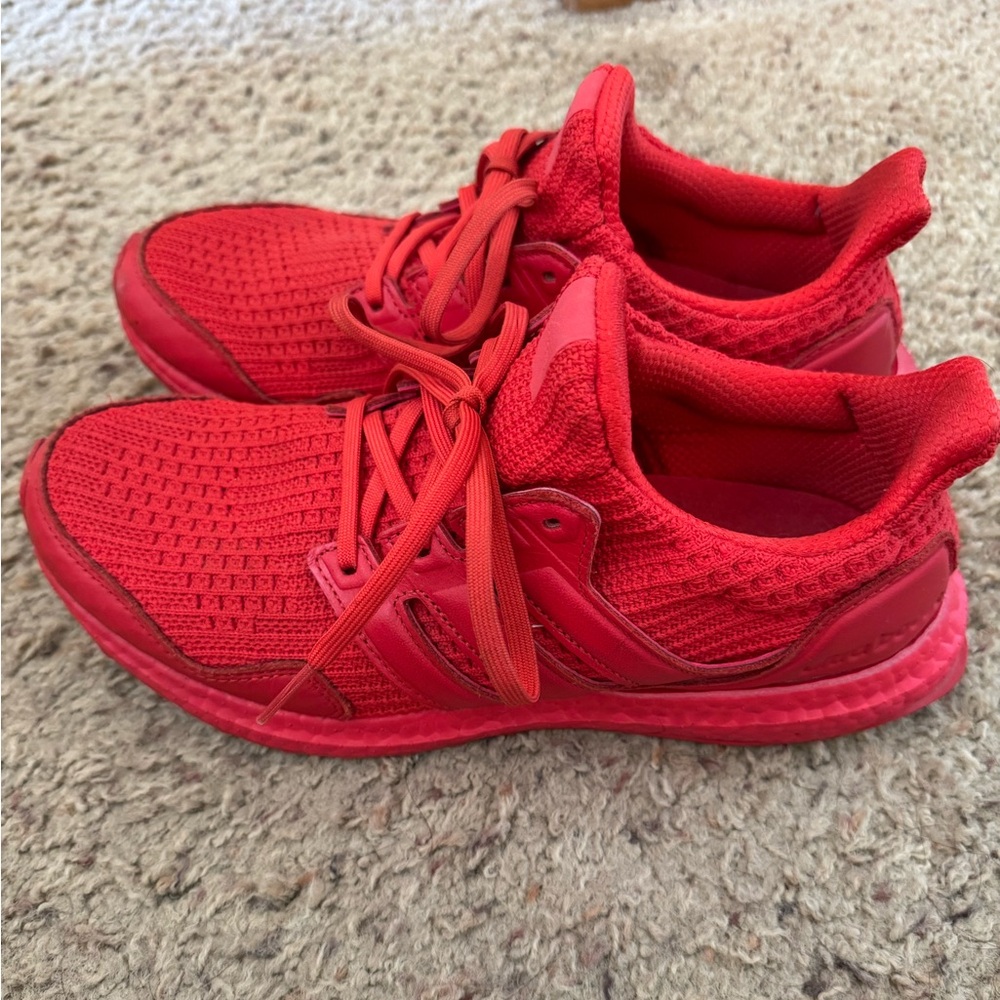 Red Adidas Ultraboost, women’s size 8.5, good condition.